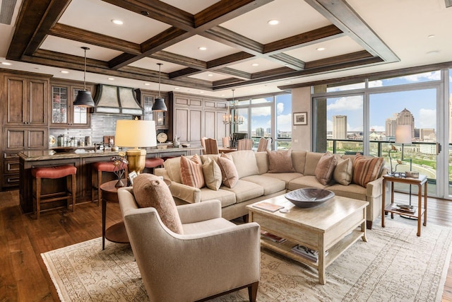 living area featuring a view of city, coffered ceiling, and wood finished floors