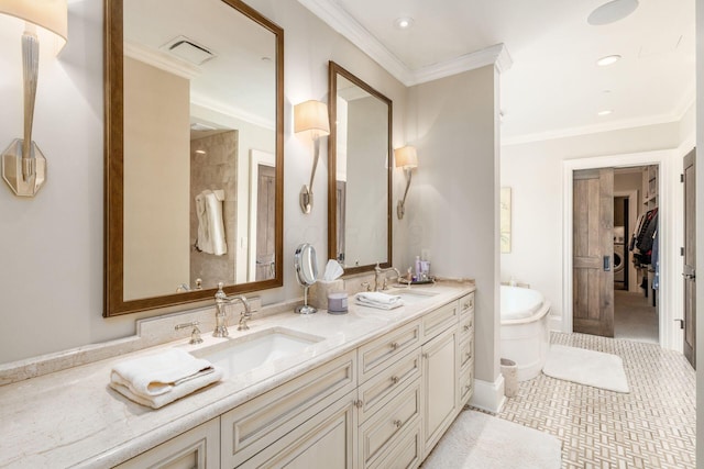 bathroom with double vanity, a sink, a freestanding tub, and recessed lighting