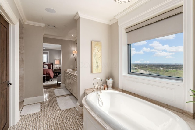ensuite bathroom featuring crown molding, vanity, ensuite bathroom, and a bath