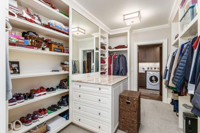1 Miranova Pl Unit 2230, Columbus, OH 43215 - walk in closet with washer / clothes dryer and light colored carpet