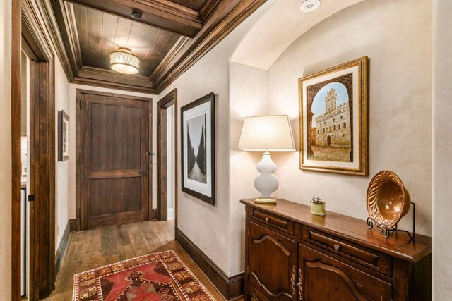 1 Miranova Pl Unit 2230, Columbus, OH 43215 - hall featuring crown molding, dark wood-style flooring, baseboards, and wooden ceiling