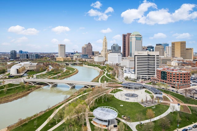 birds eye view of property featuring a view of city and a water view