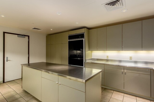 1 Miranova Pl Unit 2230, Columbus, OH 43215 - kitchen featuring light tile patterned floors, stainless steel counters, and visible vents