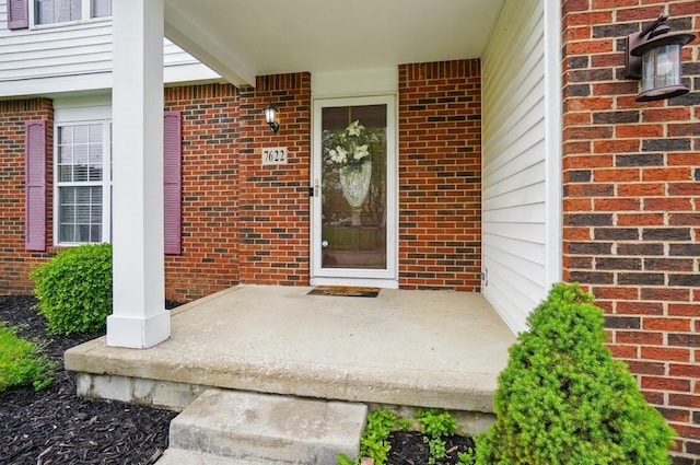 7622 Elgin Trail Dr, Blacklick, OH 43004 - view of exterior entry featuring covered porch and brick siding