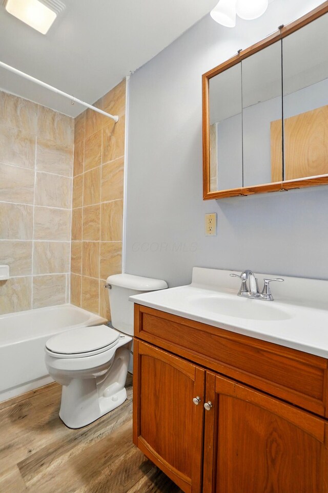 7622 Elgin Trail Dr, Blacklick, OH 43004 - full bath with vanity, toilet, shower / washtub combination, and wood finished floors