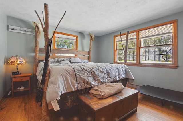 bedroom with wood finished floors