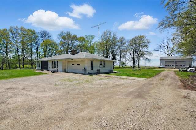 bungalow-style house featuring dirt driveway, a front lawn, and a chimney