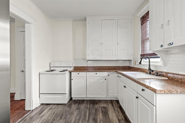 kitchen featuring white electric range oven, a sink, white cabinetry, dark wood-style flooring, and decorative backsplash