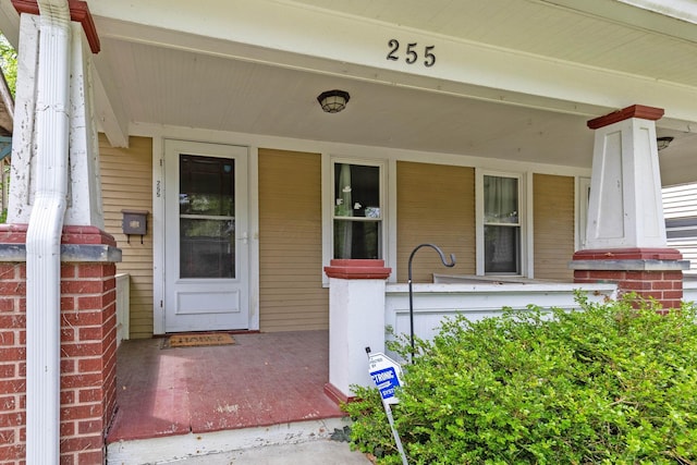 property entrance featuring covered porch