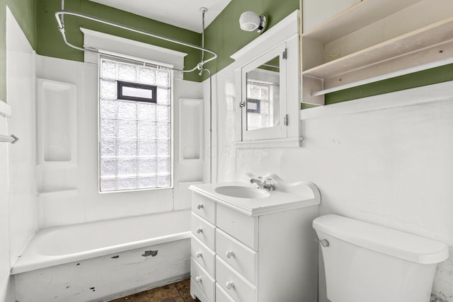 full bathroom featuring toilet, vanity, and shower / washtub combination