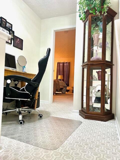 4708 Parrau Dr Unit 60D, Columbus, OH 43228 - home office featuring baseboards and a textured ceiling