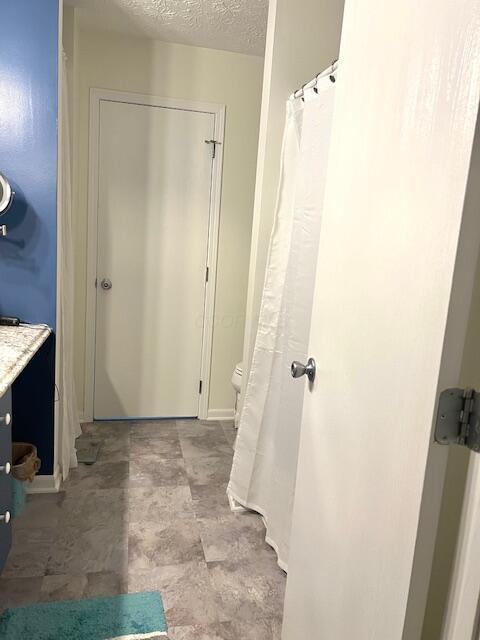4708 Parrau Dr Unit 60D, Columbus, OH 43228 - full bathroom with vanity and a textured ceiling