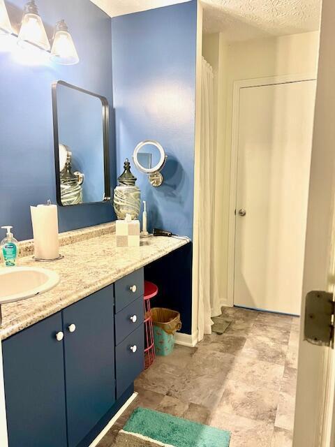 4708 Parrau Dr Unit 60D, Columbus, OH 43228 - full bath with a textured ceiling and vanity