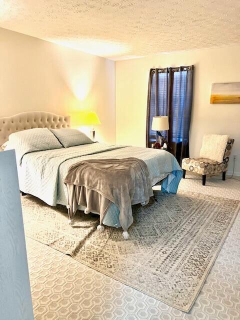 4708 Parrau Dr Unit 60D, Columbus, OH 43228 - bedroom featuring a textured ceiling
