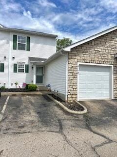 4708 Parrau Dr Unit 60D, Columbus, OH 43228 - view of front of home with a garage and driveway