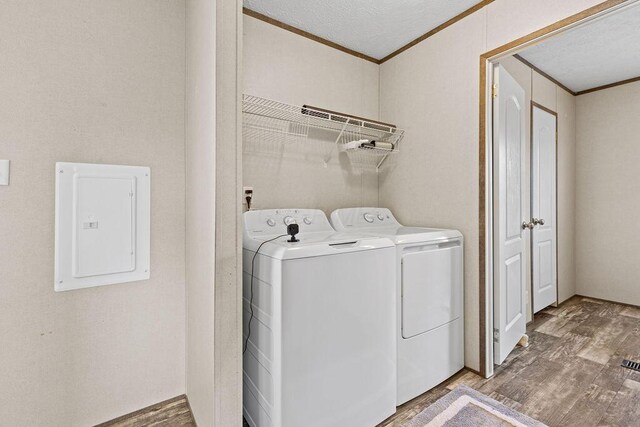 4711 Walnut Rd Lot K-5, Buckeye Lake, OH 43008 - washroom featuring laundry area, electric panel, crown molding, washing machine and dryer, and wood finished floors