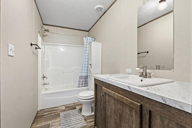 4711 Walnut Rd Lot K-5, Buckeye Lake, OH 43008 - bathroom featuring vanity, toilet, a textured ceiling, shower / bathtub combination with curtain, and wood finished floors