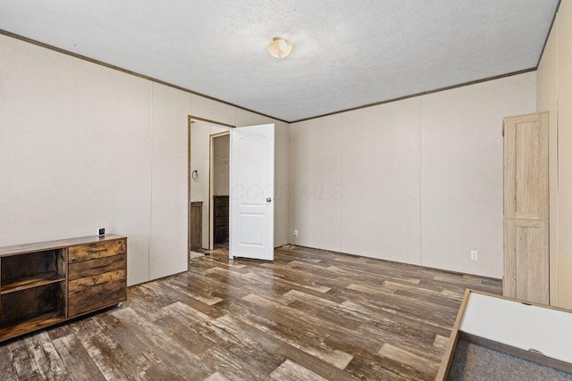 4711 Walnut Rd Lot K-5, Buckeye Lake, OH 43008 - empty room featuring crown molding, a textured ceiling, and wood finished floors