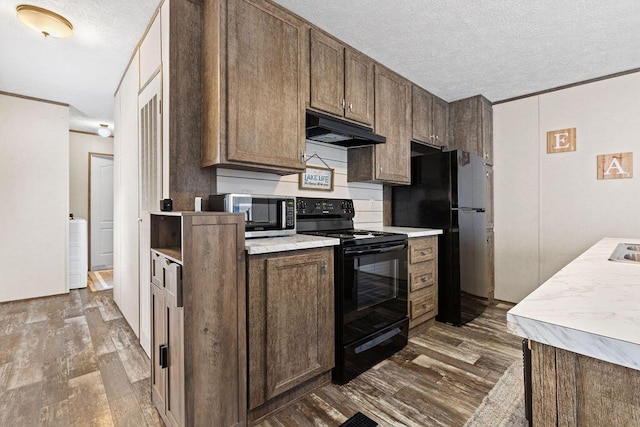 4711 Walnut Rd Lot K-5, Buckeye Lake, OH 43008 - kitchen with dark wood-type flooring, a textured ceiling, under cabinet range hood, and black appliances