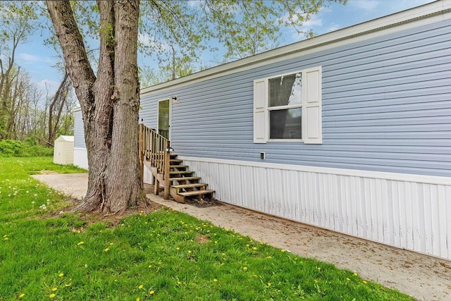 4711 Walnut Rd Lot K-5, Buckeye Lake, OH 43008 - view of home's exterior featuring stairs and a yard
