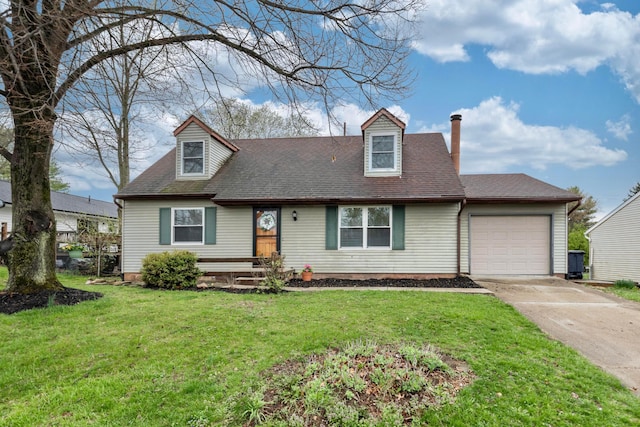 311 Williamsburg Ln NW, Lancaster, OH 43130 - cape cod house featuring driveway, a shingled roof, a front yard, and a garage