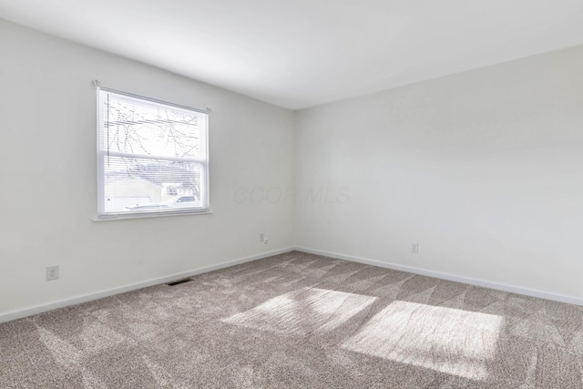 311 Williamsburg Ln NW, Lancaster, OH 43130 - carpeted spare room featuring baseboards and visible vents
