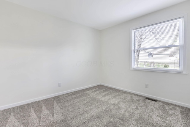 311 Williamsburg Ln NW, Lancaster, OH 43130 - carpeted empty room with baseboards and visible vents