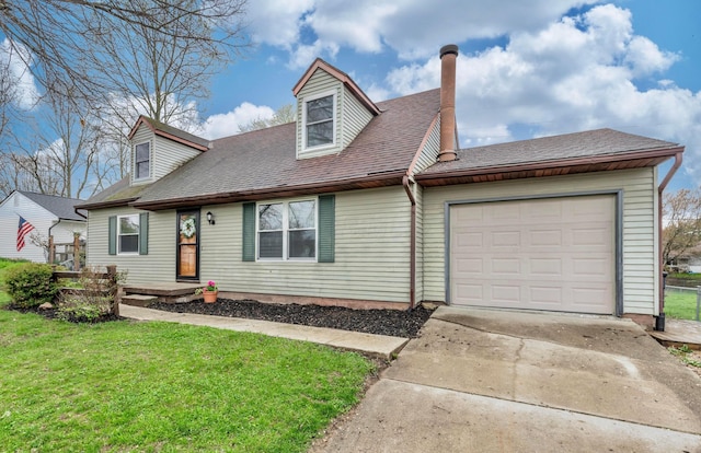 311 Williamsburg Ln NW, Lancaster, OH 43130 - cape cod home featuring a garage, driveway, a front yard, and a shingled roof