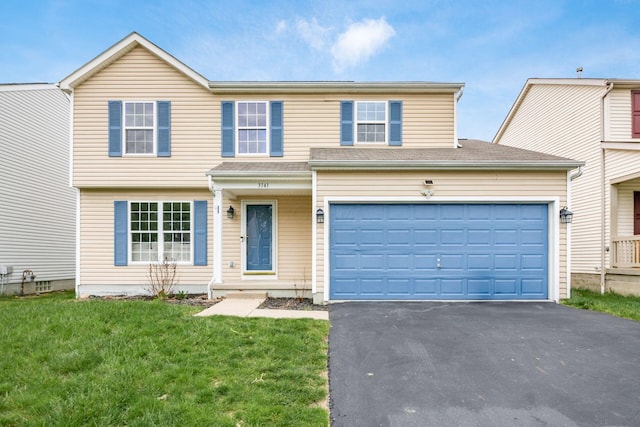 3141 Amberfield Dr, Columbus, OH 43232 - traditional home featuring a garage, a front lawn, and driveway