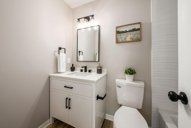 3141 Amberfield Dr, Columbus, OH 43232 - bathroom with vanity, baseboards, toilet, and wood finished floors