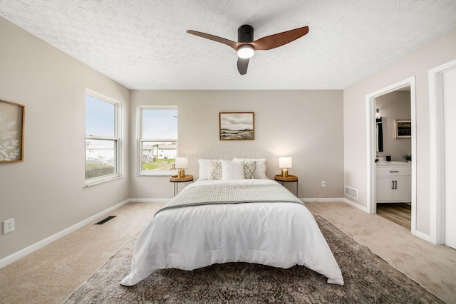 3141 Amberfield Dr, Columbus, OH 43232 - bedroom with visible vents, a textured ceiling, carpet, and baseboards