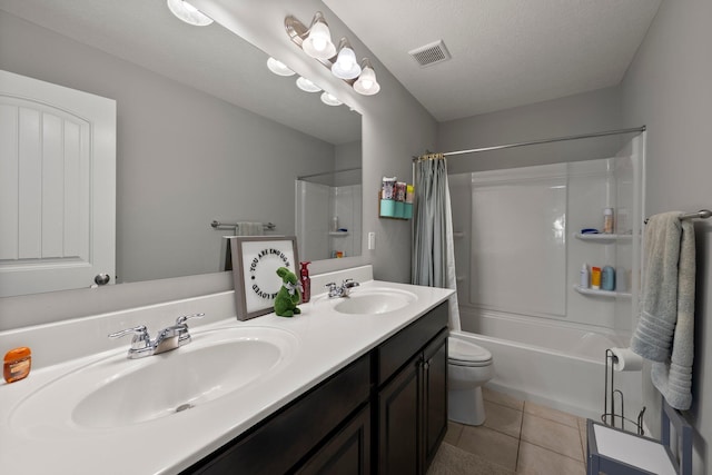 bathroom featuring visible vents, a sink, double vanity, and shower / tub combo