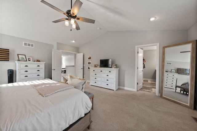 bedroom with visible vents, baseboards, lofted ceiling, and light carpet