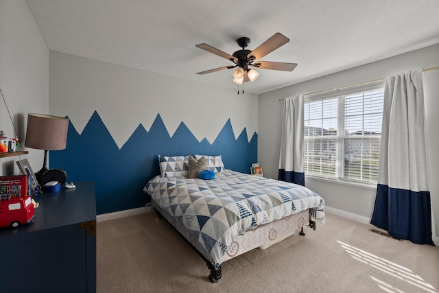 bedroom with carpet floors, baseboards, and ceiling fan