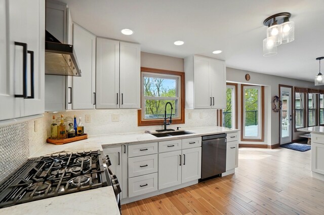 9127 Red Cedar Dr, West Chester, OH 45069 - kitchen with a sink, backsplash, dishwasher, and a wealth of natural light