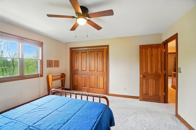 9127 Red Cedar Dr, West Chester, OH 45069 - carpeted bedroom with a ceiling fan, baseboards, and a closet