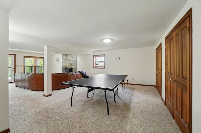 9127 Red Cedar Dr, West Chester, OH 45069 - recreation room with baseboards, a fireplace, and light carpet