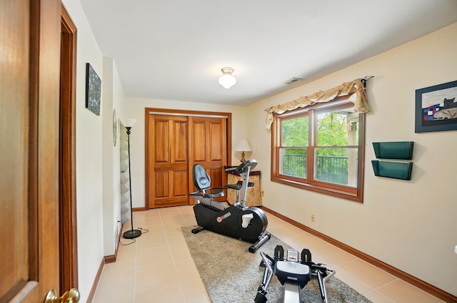 9127 Red Cedar Dr, West Chester, OH 45069 - workout room featuring visible vents, baseboards, and light tile patterned flooring
