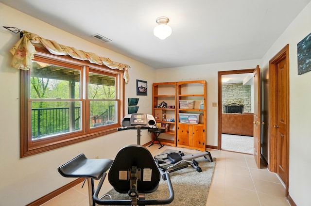 9127 Red Cedar Dr, West Chester, OH 45069 - workout area featuring baseboards, visible vents, and light tile patterned floors