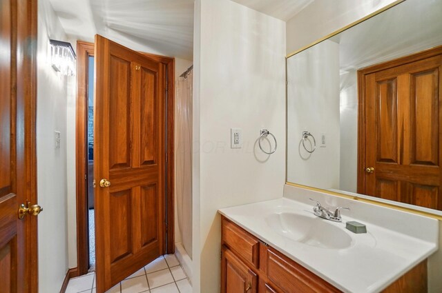 9127 Red Cedar Dr, West Chester, OH 45069 - bathroom with baseboards, tile patterned flooring, and vanity