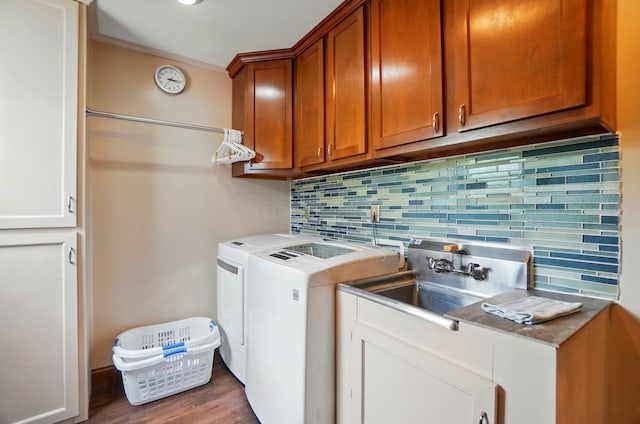 9127 Red Cedar Dr, West Chester, OH 45069 - laundry area with independent washer and dryer, crown molding, cabinet space, wood finished floors, and a sink