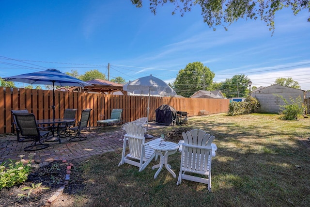view of yard with a fenced backyard and a patio area