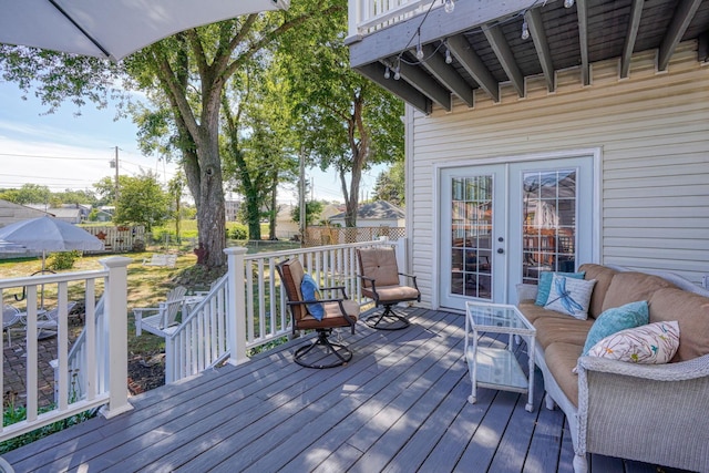 wooden terrace with fence and french doors