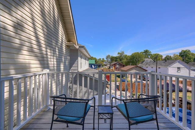 wooden deck with a residential view