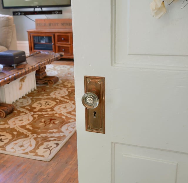 hallway with wood-type flooring