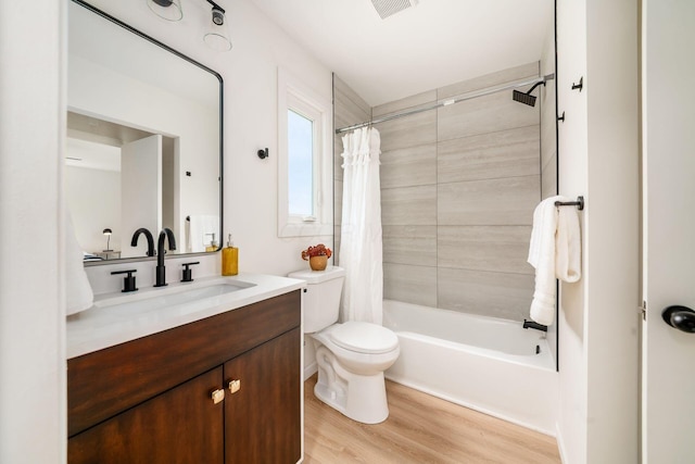 86 Hiawatha Ave, Westerville, OH 43081 - full bathroom with vanity, visible vents, wood finished floors, toilet, and shower / tub combo