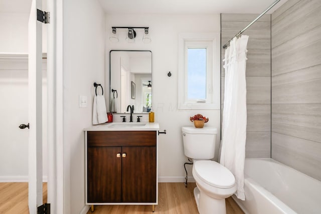 86 Hiawatha Ave, Westerville, OH 43081 - full bath with wood finished floors, shower / tub combo, vanity, baseboards, and toilet