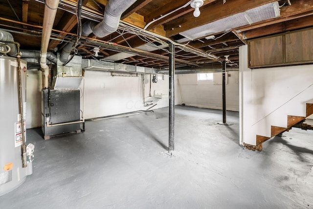 86 Hiawatha Ave, Westerville, OH 43081 - basement featuring heating unit, stairs, and gas water heater