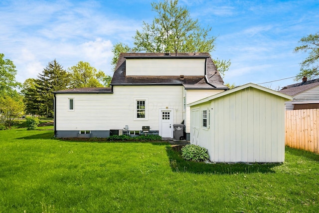 86 Hiawatha Ave, Westerville, OH 43081 - back of house featuring a yard, fence, roof with shingles, and cooling unit