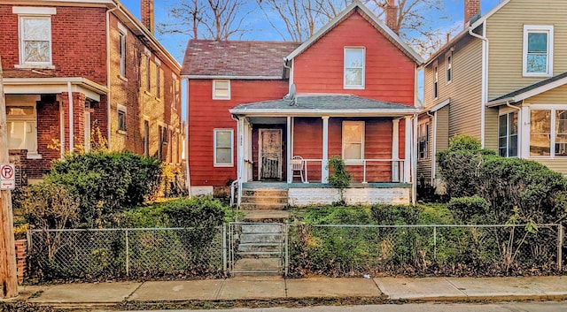 605 S 22nd St, Columbus, OH 43205 - traditional home featuring a porch, a fenced front yard, and a gate
